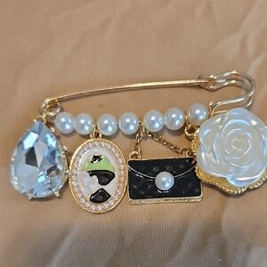 be inspired Gold-Tone Brooch with White Rose, Black Purse and Clear Teardrop